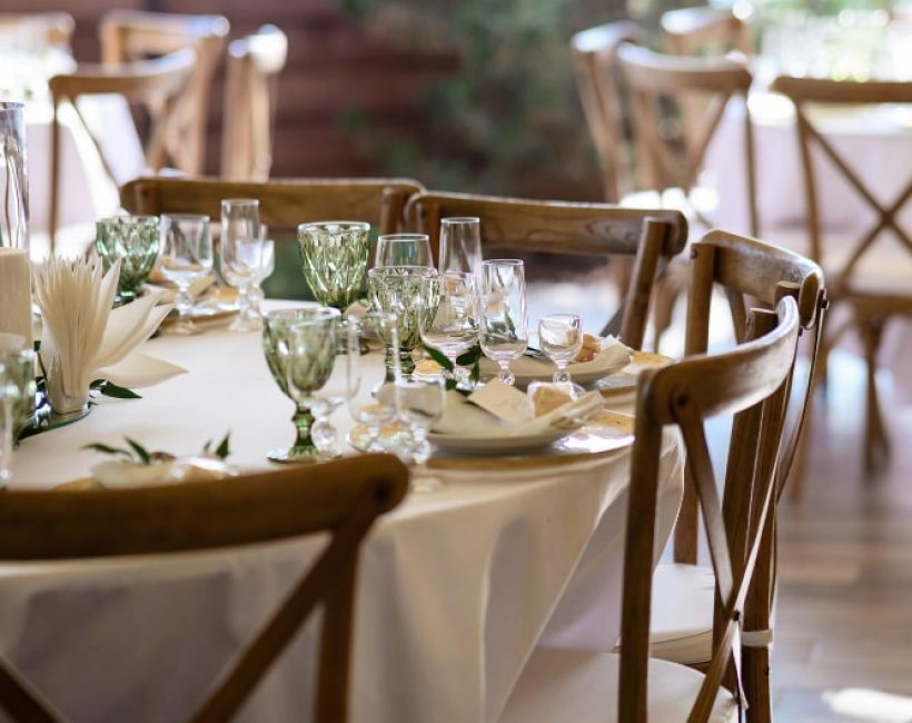 white-table-with-tableware-chairs-made-wood-min